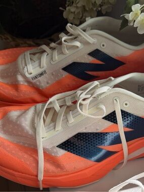 New balance Orange fuel cell rebel Running Shoes with black and white Details